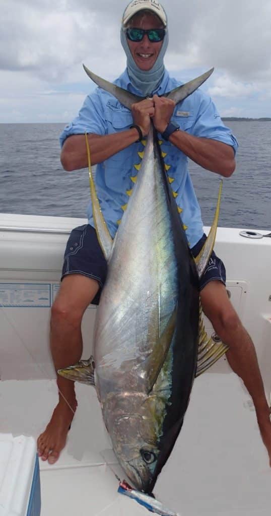 Angler holding a tuna fish caught in The Seychelles in the Indian Ocean