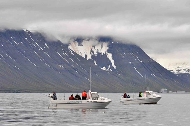 Anglers fishing a rental boat off Sudavik Iceland