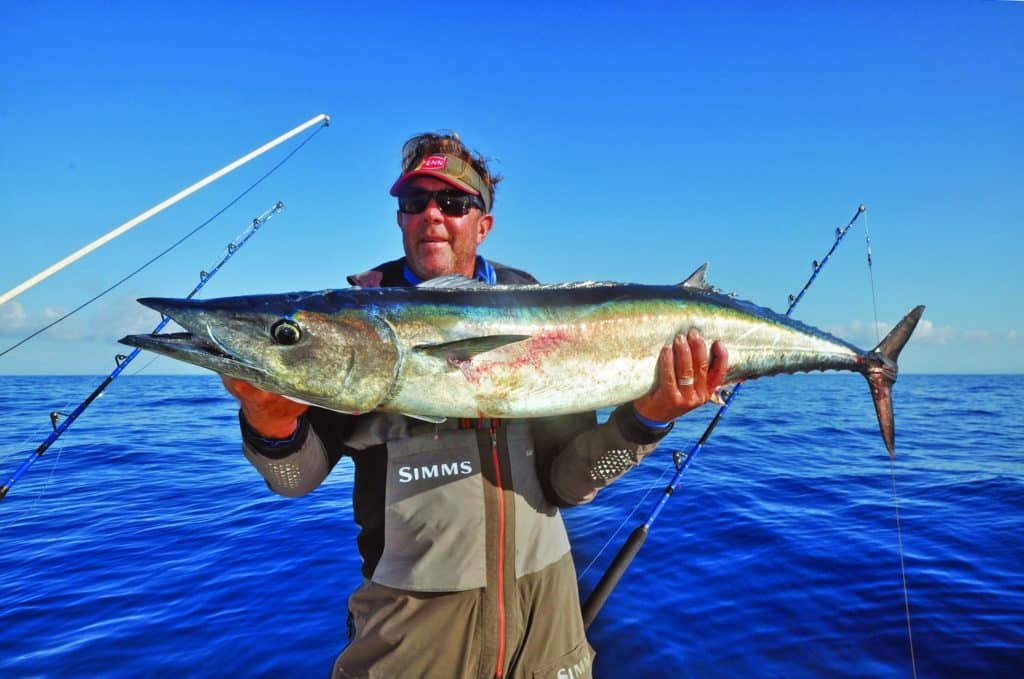 Fisherman holding wahoo fish caught fishing in California