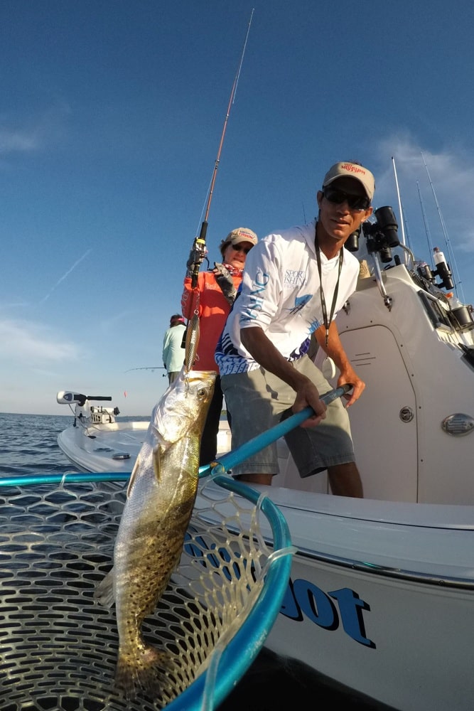 Capt. Sonny Schindler lands a seatrout off the Mississippi coast