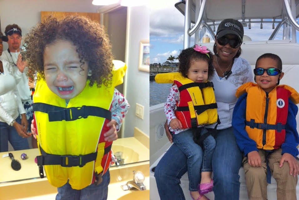 Toddler wearing life jacket fishing boat Miami, Florida