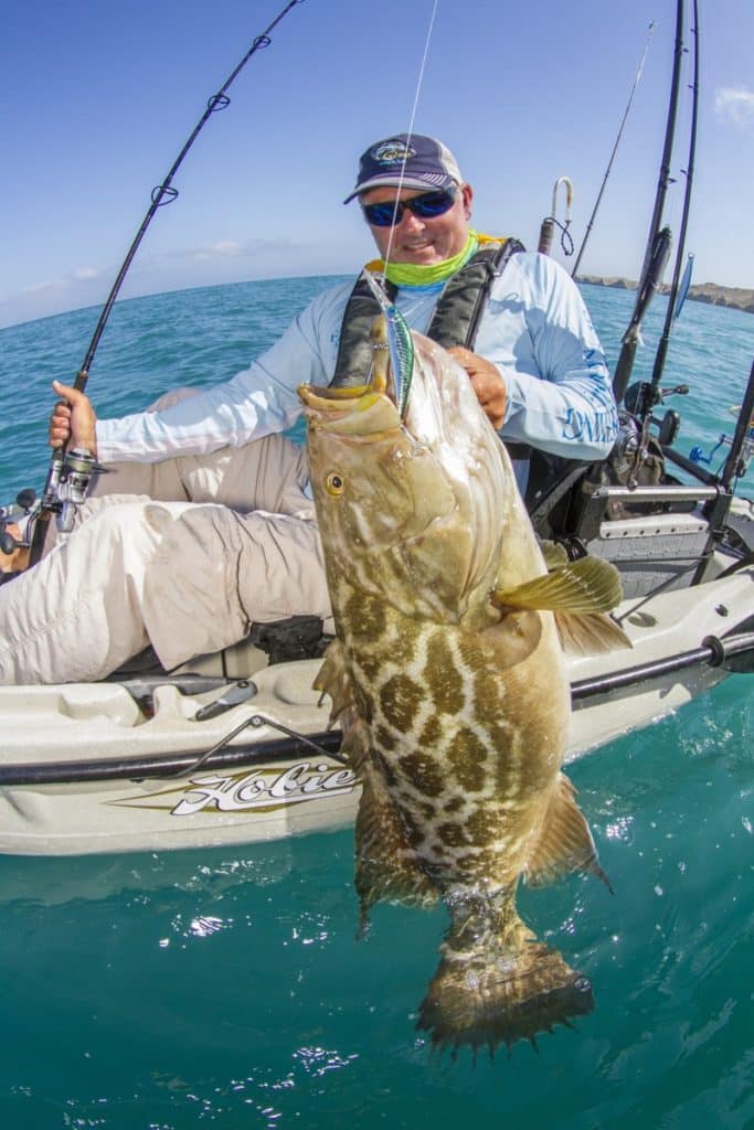 Kayak fishing Cedros Island, Baja -- angler lands a big broomtail grouper