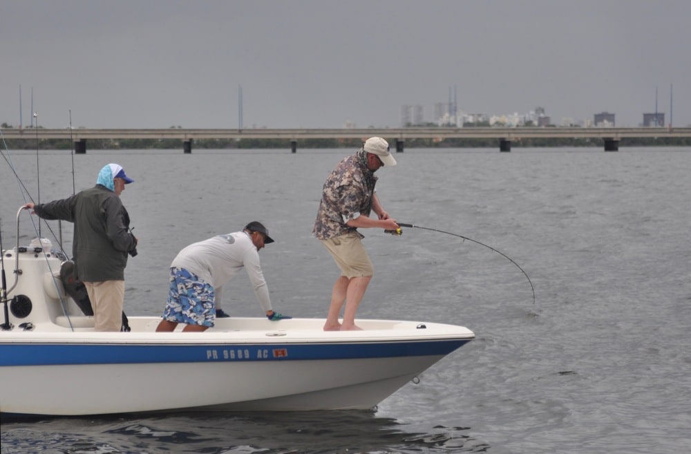 Angler fishing San Jose Lagoon next to the city of San Juan in Puerto Rico