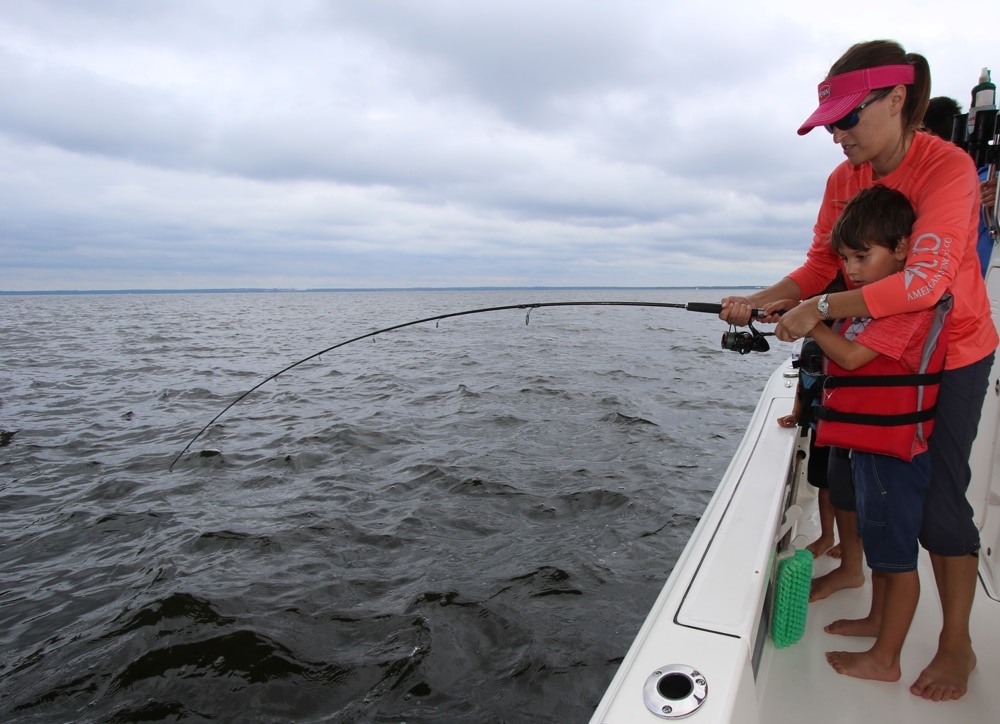 Mother and son fight a large drum in Mississippi coastal waters