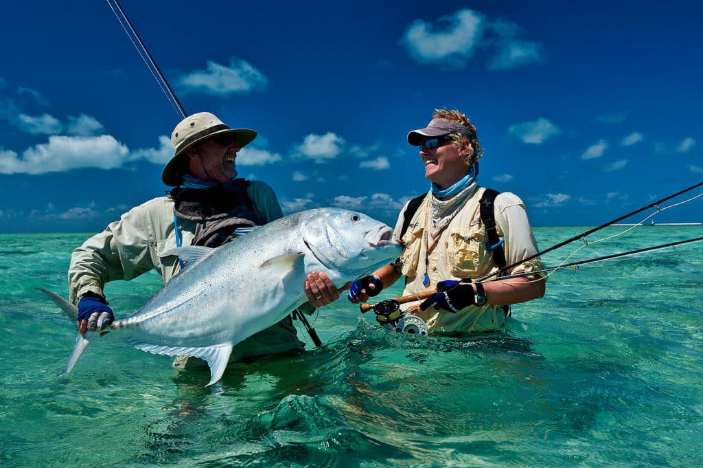 Dazzling fishing photography of Henry Gilbey - giant trevally on fly rod