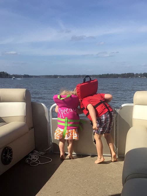 Brother and sister wearing life jackets Lake Murray, Columbia, South Carolina