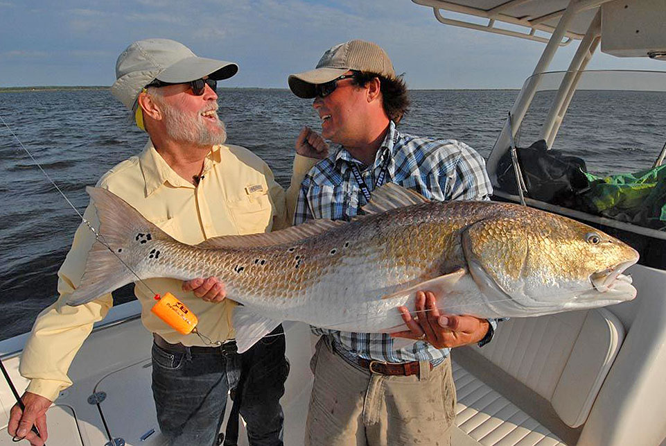 50-plus-pound redfish and two fishermen