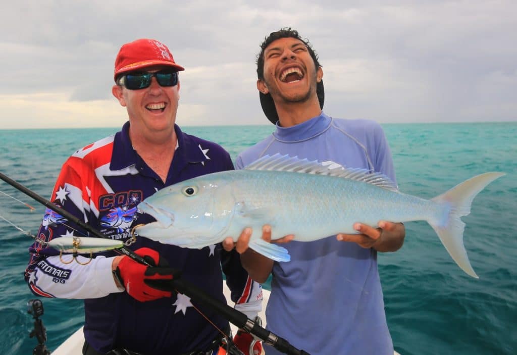 Two anglers holding a jobfish