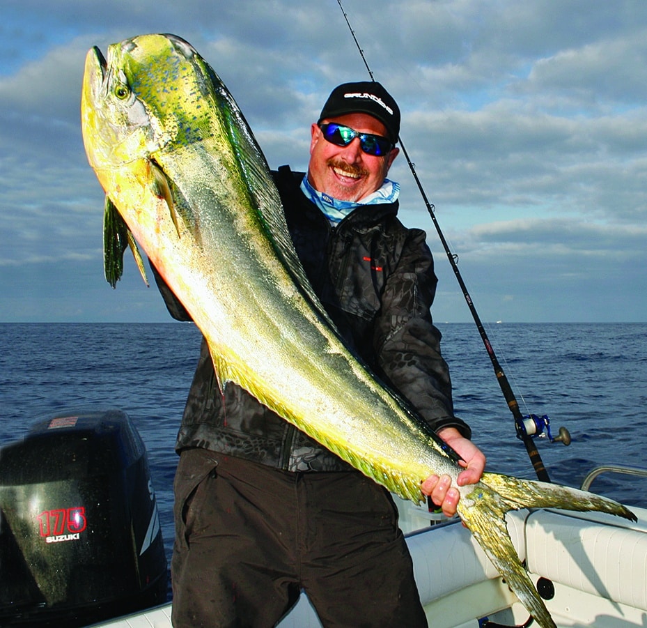 Fisherman holding mahimahi fish caught in Southern California