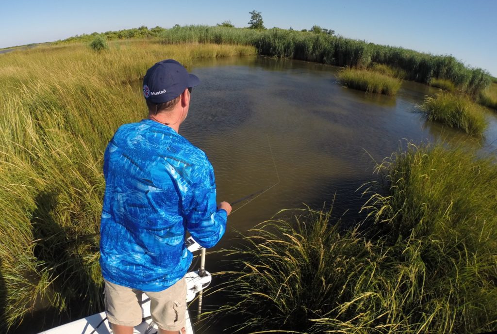 Fishing angler casting a crankbait fishing lure