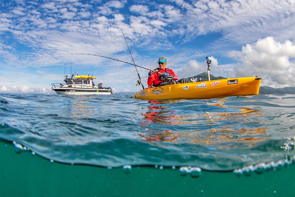 kayak angler trolls for coho.