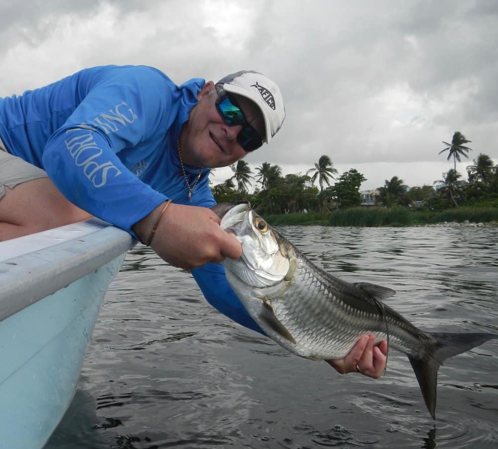 Journalist Dave Lewis about to release a fun-size tarpon in Puerto Rico