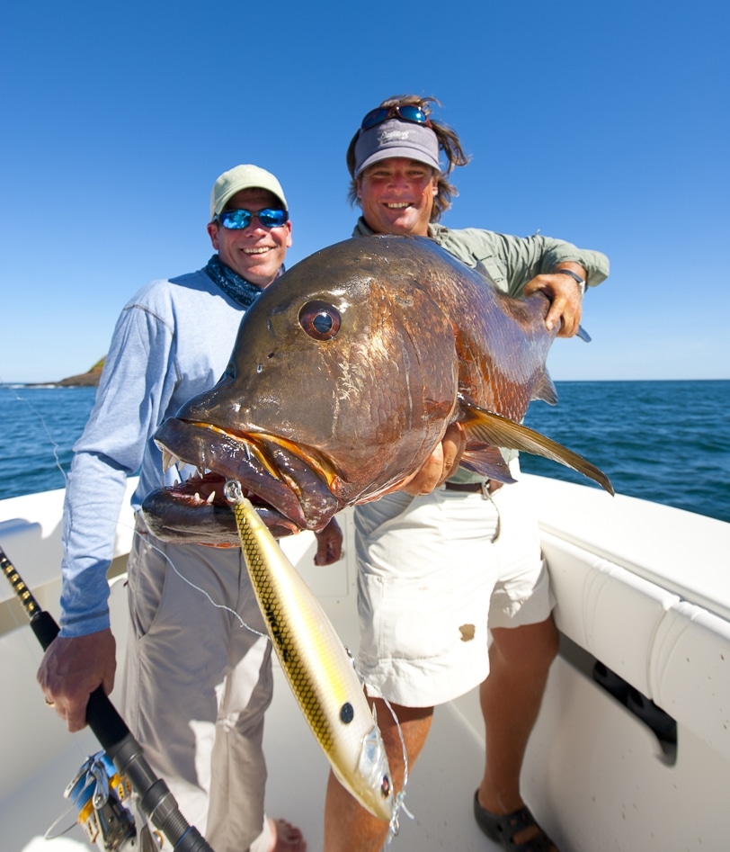 Angler holding a big fish caught fishing with a twitchbait