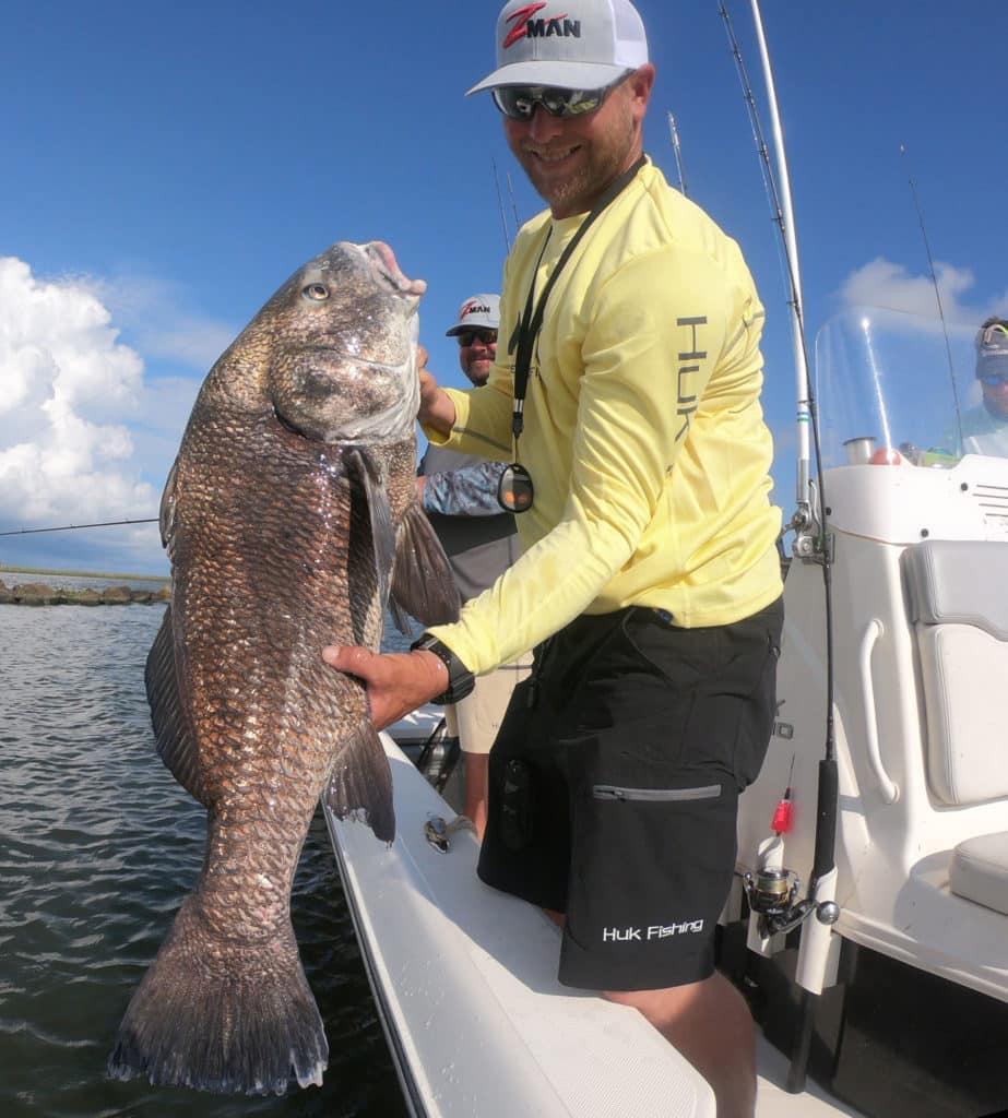 Releasing the black drum back into the Mississippi