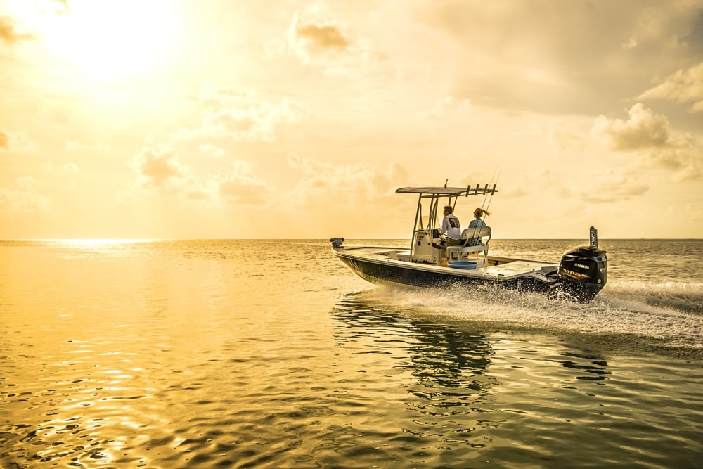 Pathfinder bay fishing boat running Florida Bay at sunrise