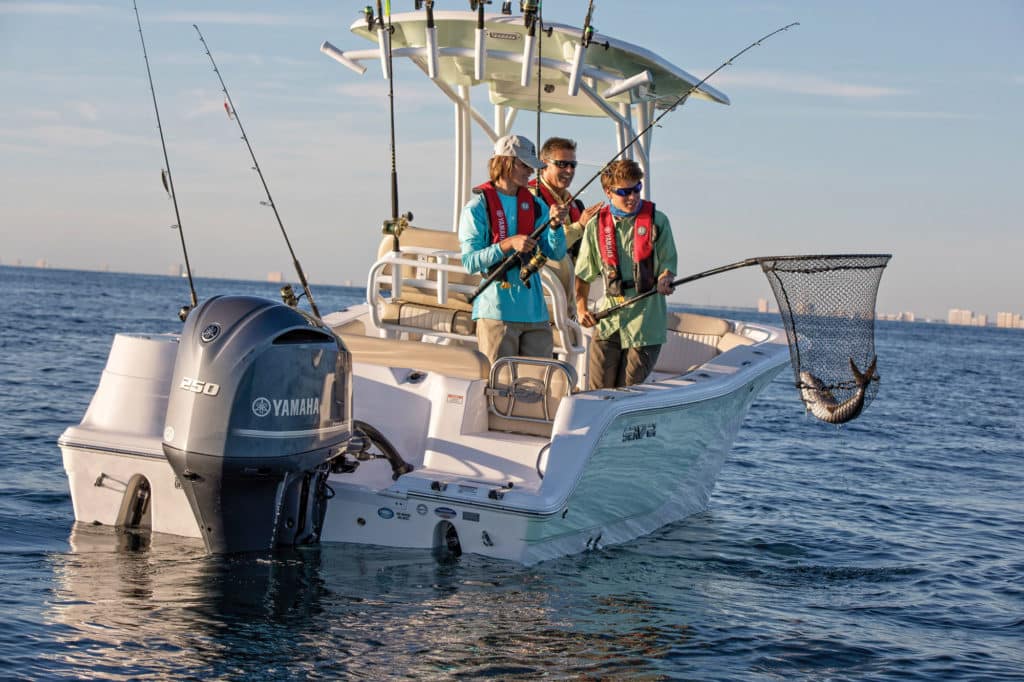 Netting a fish on a bay boat