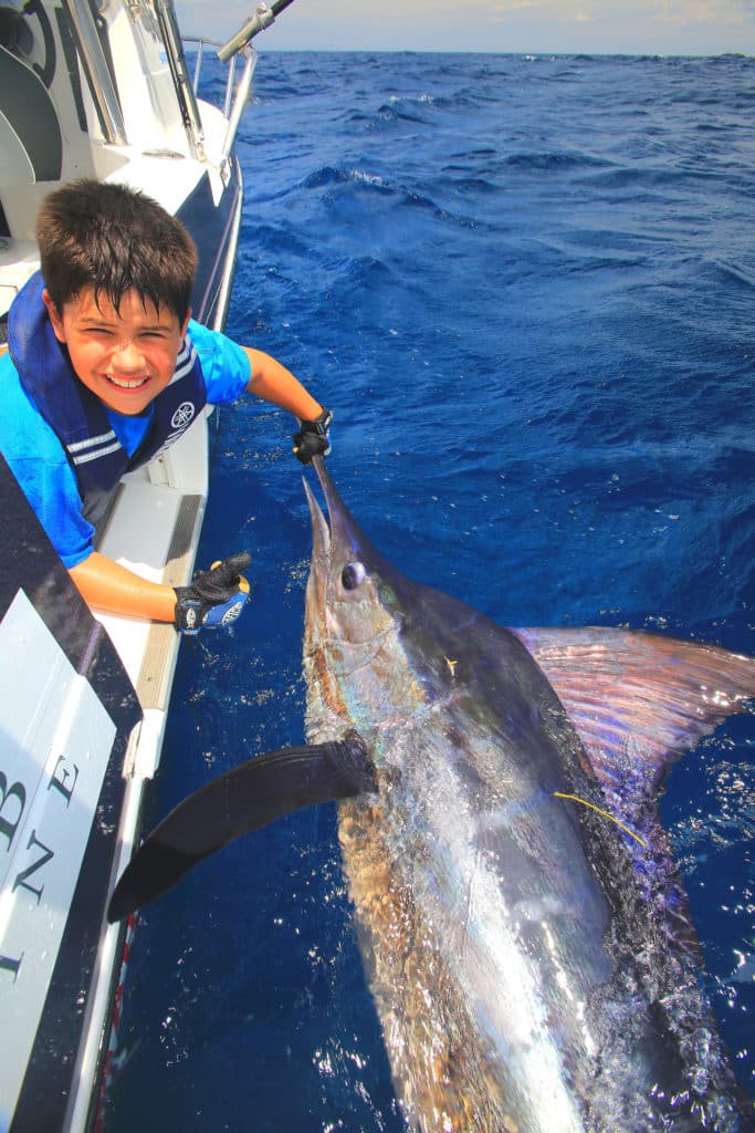 Child angler fishing for billfish