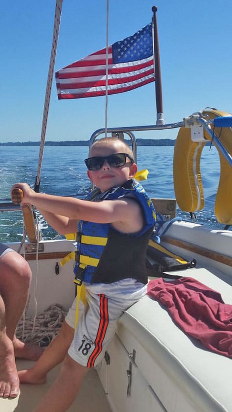 Boy wearing life jacket Puget Sound