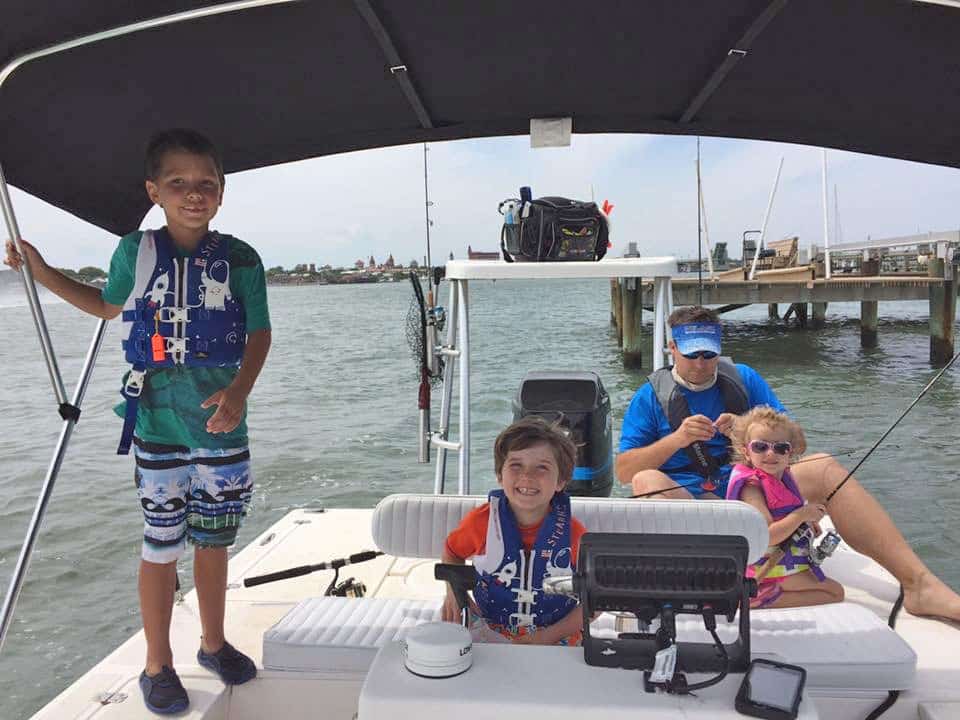 Children wearing life jackets on boat fishing St. Augustine, Florida ICW