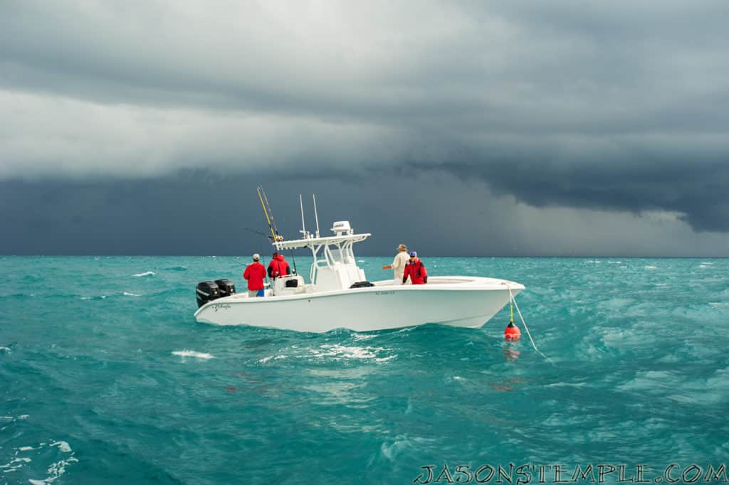 storm clouds over center console fishing boat