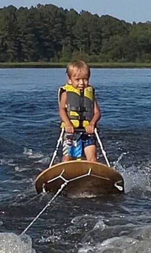 Toddler wearing life jacket boating Shearon Harris, North Carolina
