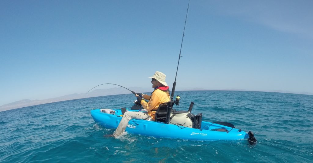 angler hooked up saltwater kayak fishing Baja's central Sea of Cortez near Loreto