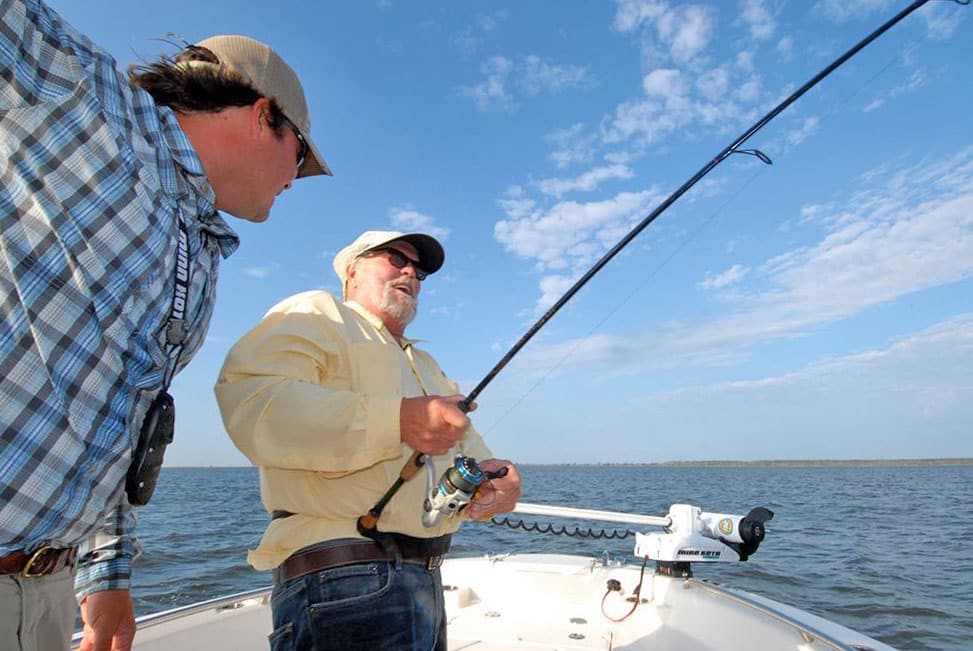 Two anglers fishing spinning reel North Carolina's Pamlico Sound