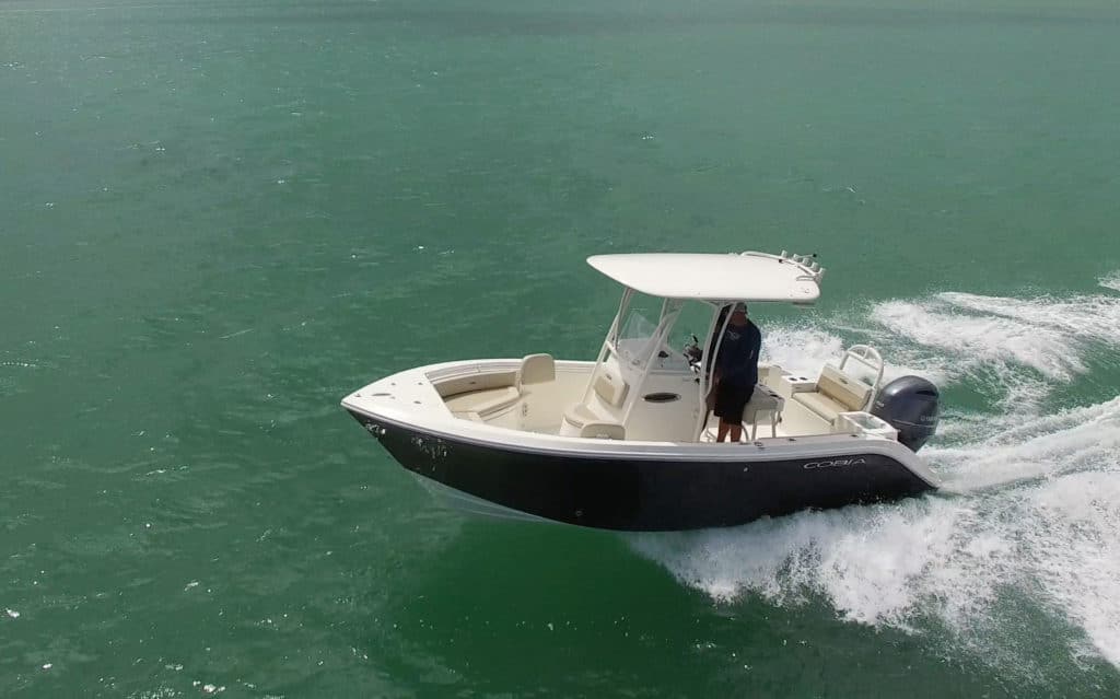 Cobia 220 CC cutting across the waves
