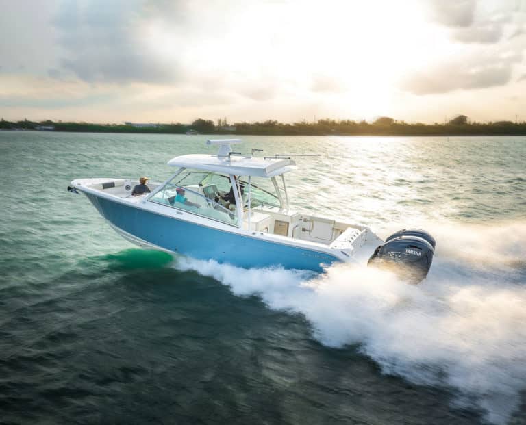 Dual console boat running across the bay