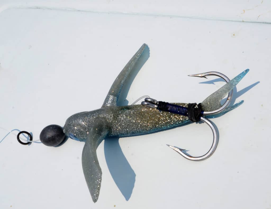 Rubber flying fish under a kite for catching tuna