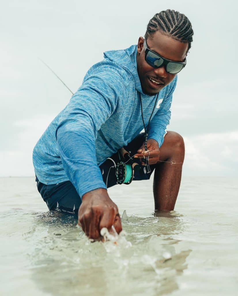 Fisherman releasing fish