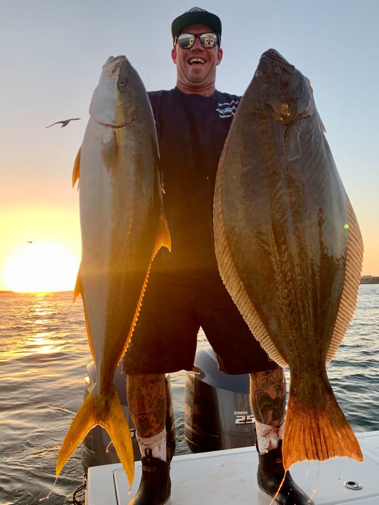 Captain Duane “Diego” Mellor holding up large fish