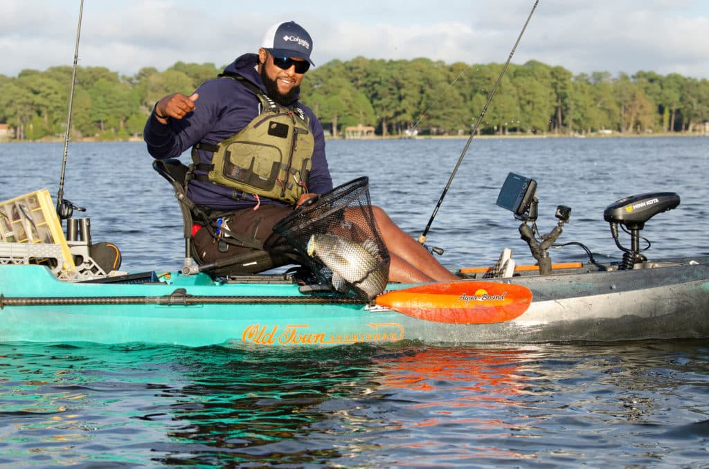 Catching a fish from a kayak