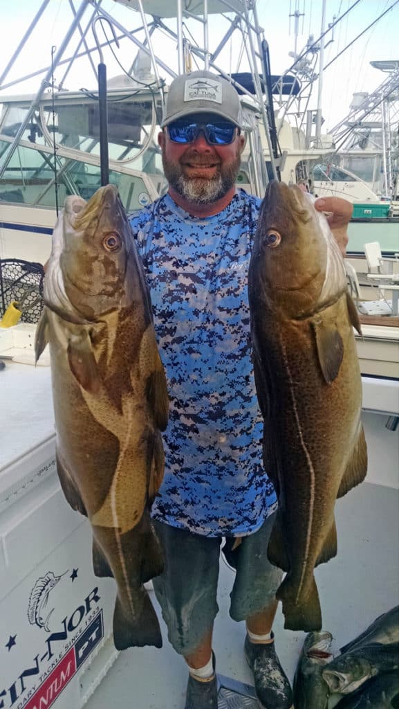 Capt. Peter Bacon with two trophy cod