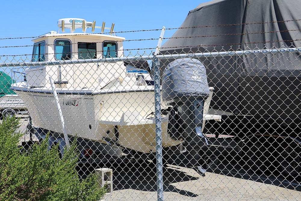 boat behind a fence