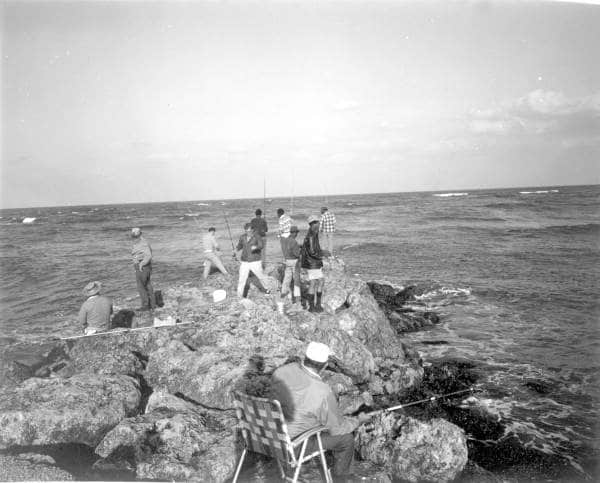 Vintage Florida fishing photo Sebastian Inlet rocks