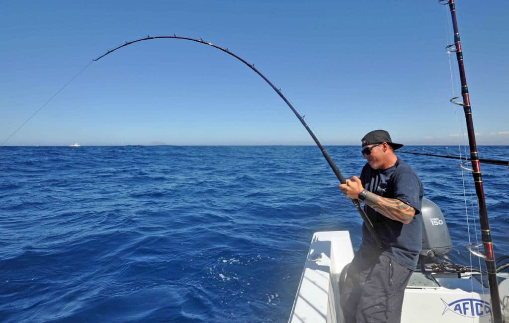 Angler fishing for California yellowtail fish