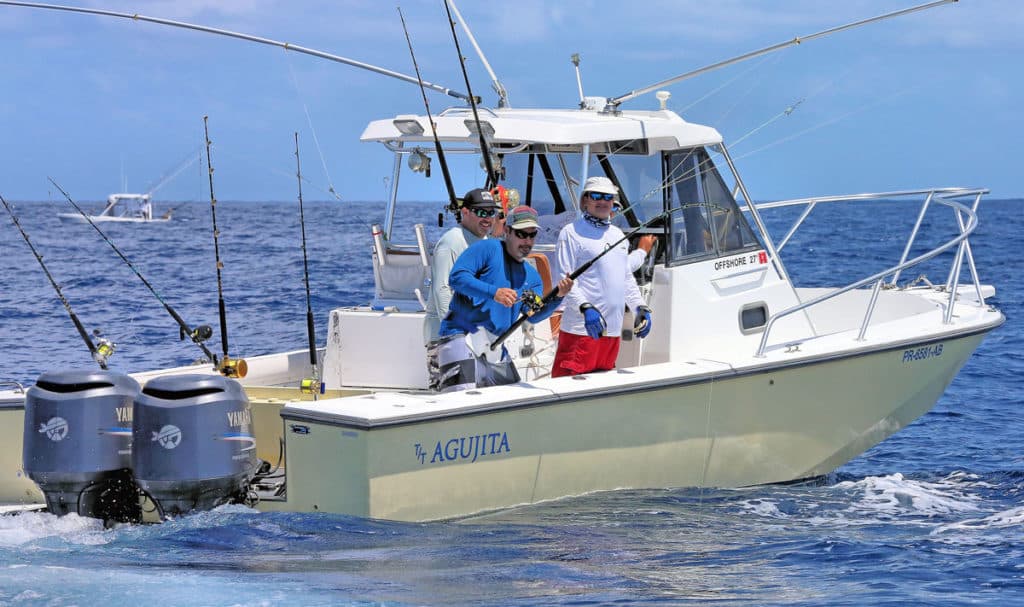 Fishing on center console outboard boat offshore