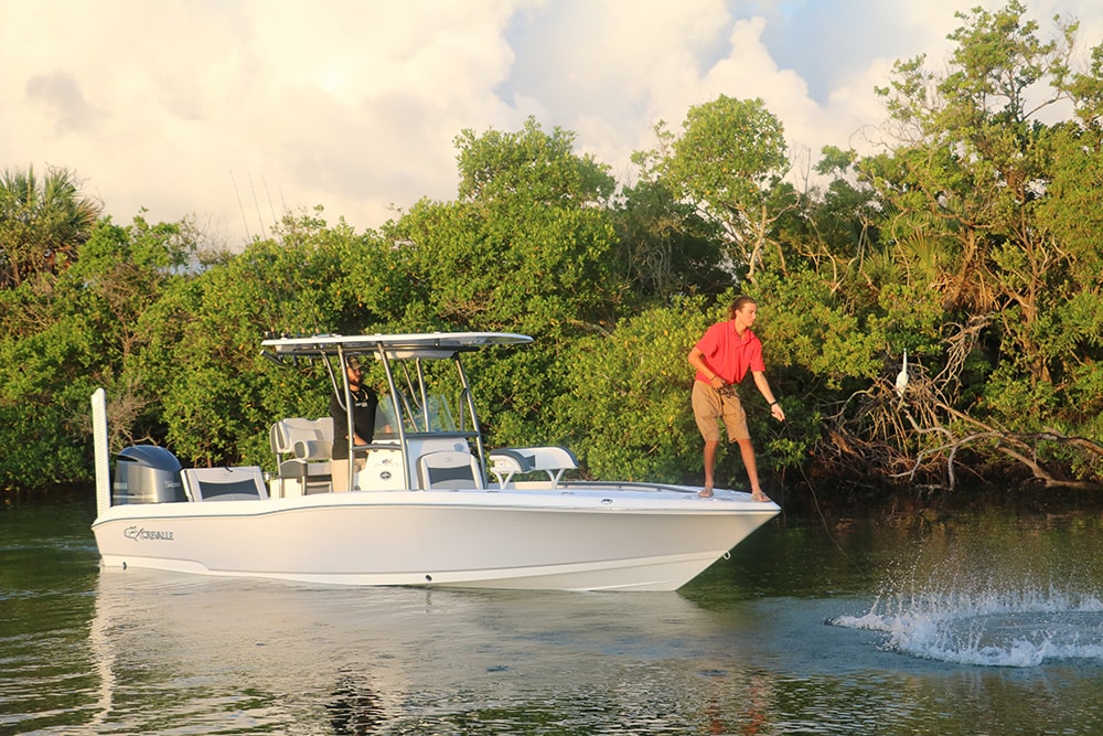 throwing a cast net from Crevalle 26 Open center console saltwater fishing boat