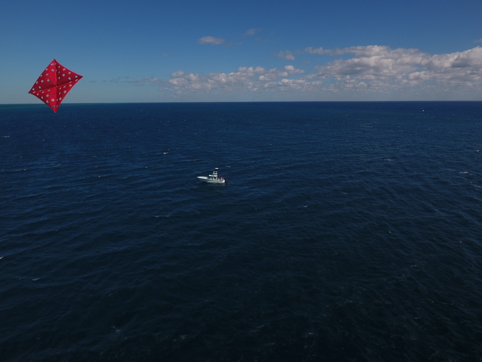 Drones and fishing - view of kite and sailfishing boat