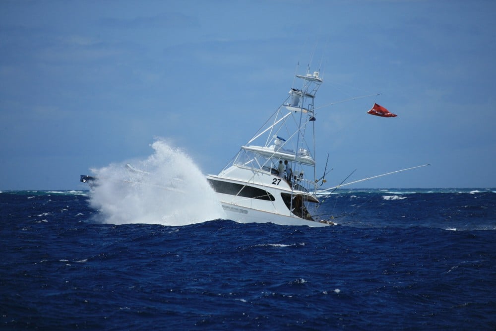 Monstrous seas don't stop this sport-fishing yacht from trolling for billfish