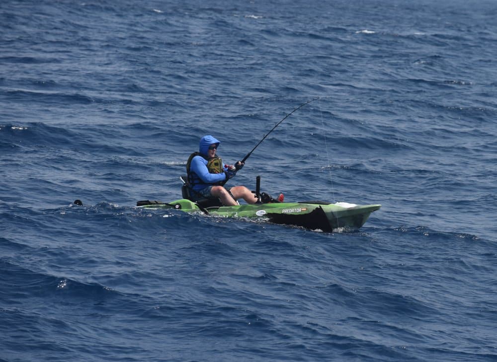 Kayak angler with big Pacific sailfish almost ready for release