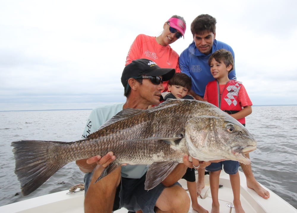 Mississippi guide Sonny Schindler about to release a young angler's first black drum
