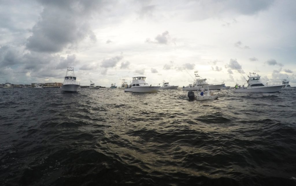 Boats fishing for live baits, early morning at Destin harbor, Florida
