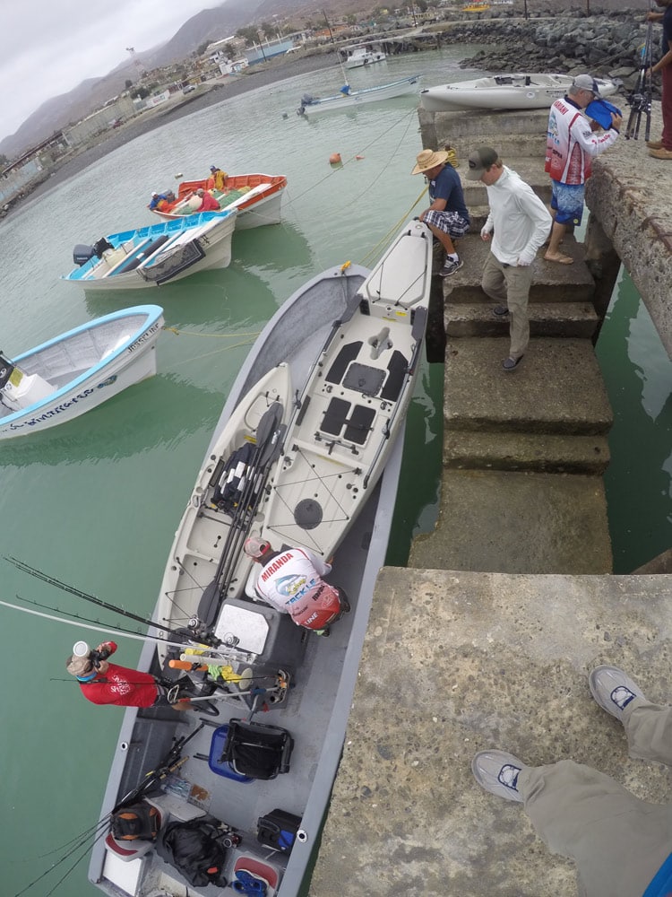 Loading kayaks into a panga in Mexico