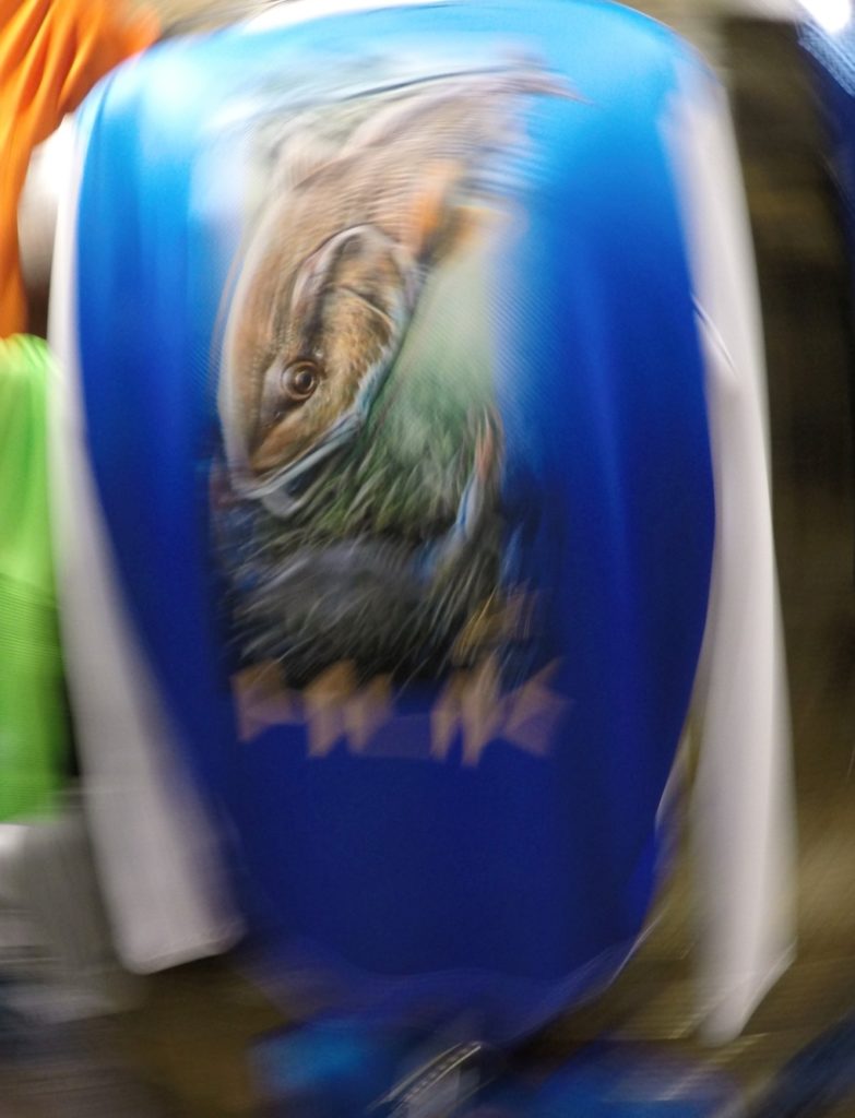 World's largest fishing tackle show -- a HUK shirt with K.C. Scott art