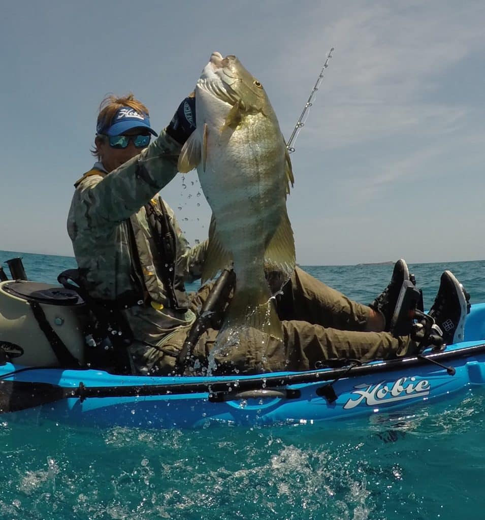 saltwater fisherman releasing barred pargo Hobie kayak fishing Baja’s Central Sea of Cortez