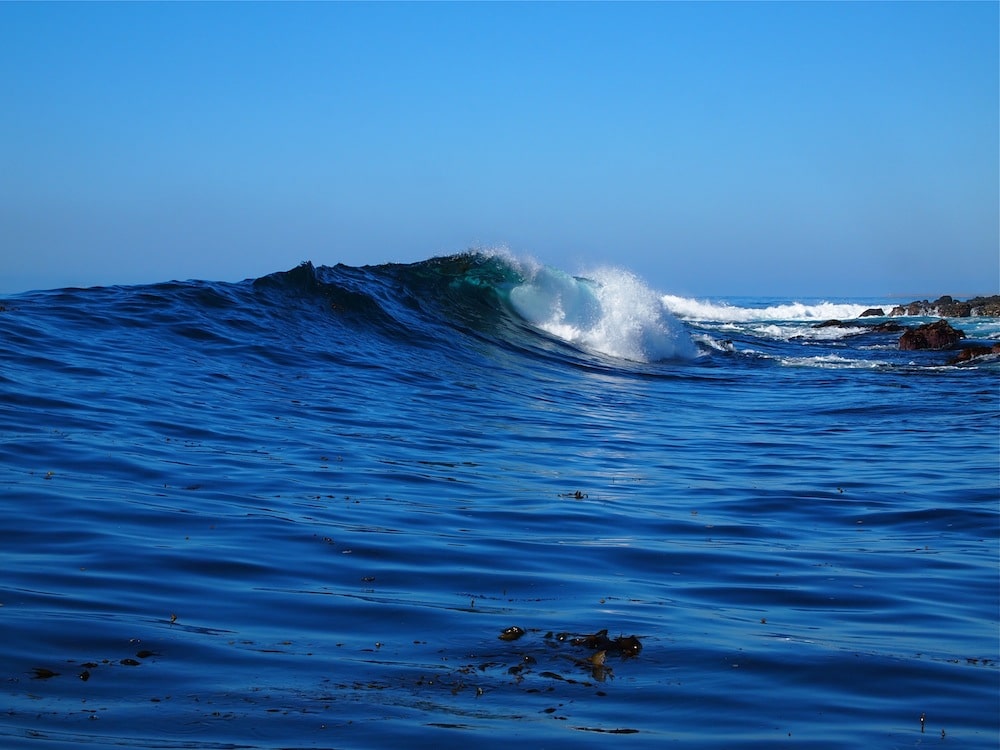 Fishing boat view of breaking swells