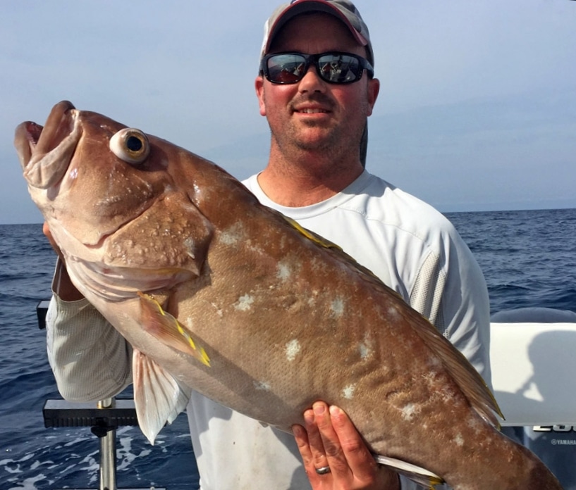 Capt. Adam Peeples, a 2017 Sport Fishing magazine Charter Captain of the Year, with a large yellowedge grouper
