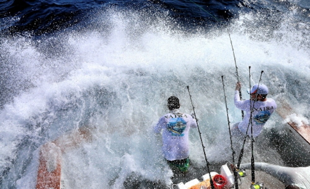 Fishermen backing down sport fishing boat
